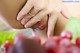 A close up of a woman's butt with a bunch of grapes.