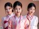 A group of three young women in hanbok posing for a picture.